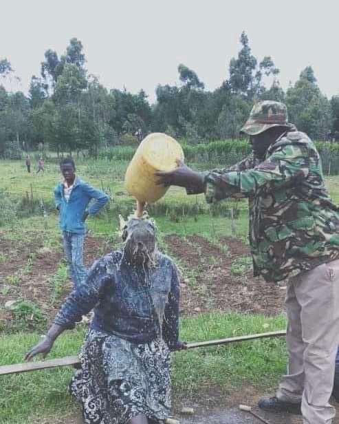 A chief pours alcohol on disabled woman in Elgeyo Marakwet County, Kenya