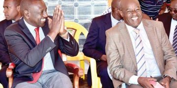 Willy Mutunga (left) with Deputy President William Ruto at a previous function.