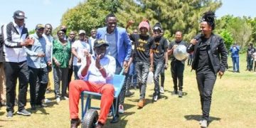 DP Ruto riding a wheelbarrow in the so called "Youth Empowerment Projects"
